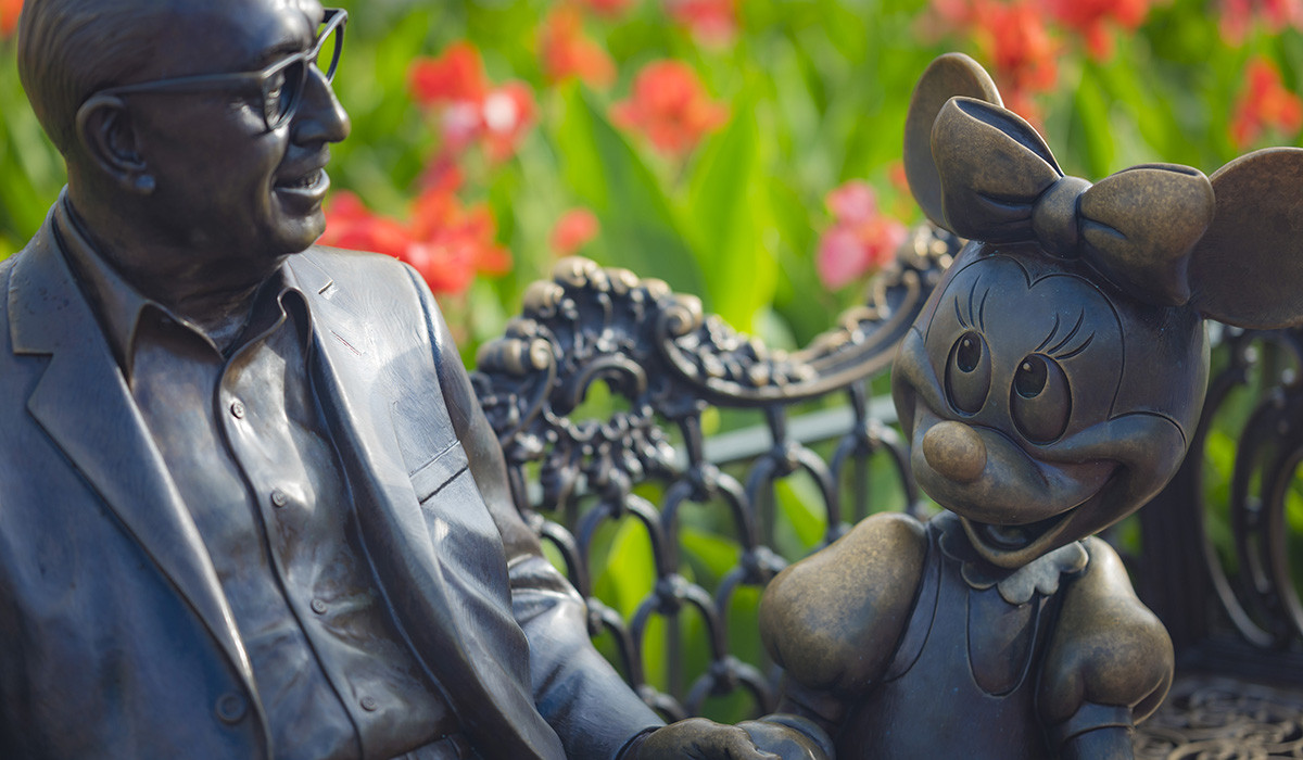 A bronze statue of Roy Disney and Minnie Mouse at the Magic Kingdom, Walt Disney World.
